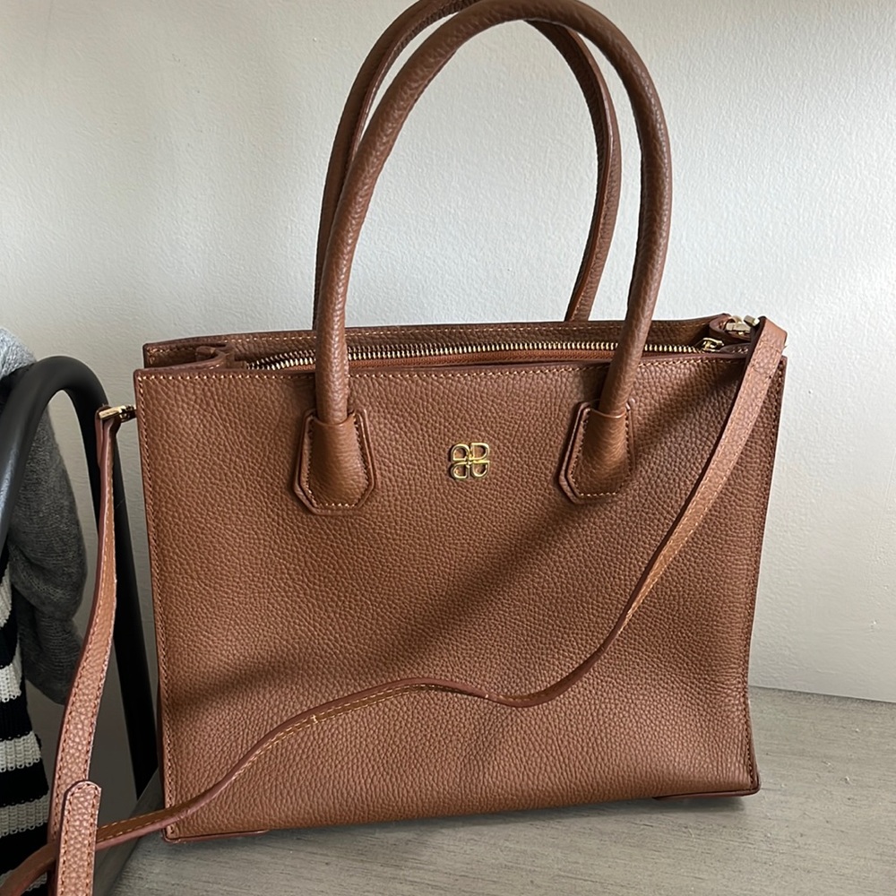 Brown leather purse with cross body strap
